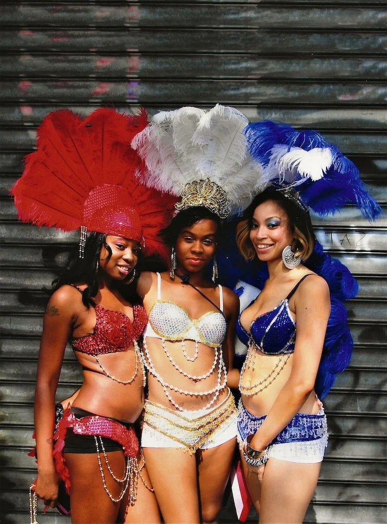 three women in costumes posing