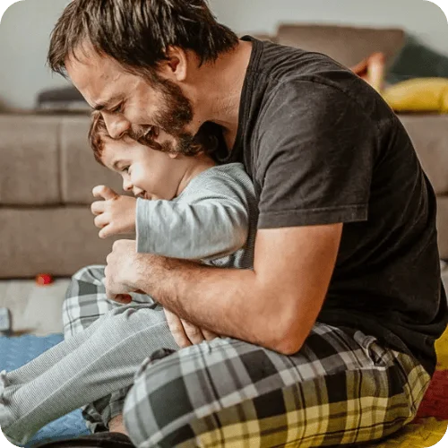 a dad with a toddler doing a calming bedtime exercise a dad with a toddler doing a calming bedtime exercise