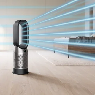 A Dyson Purifier Hot+Cool™ purifying fan heater​ in a bedroom