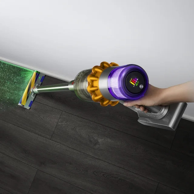 The Dyson V12 Detect Slim vacuum's Fluffy Optic™ cleaner head illuminating a floor
