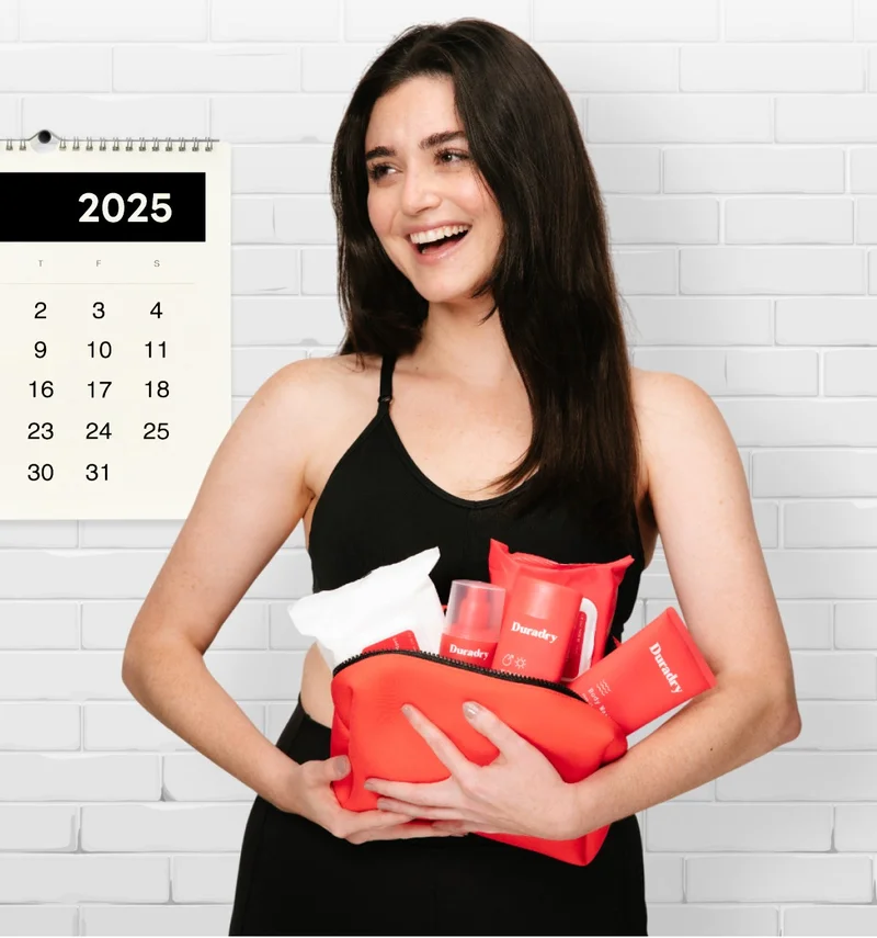 A woman holding several Duradry products