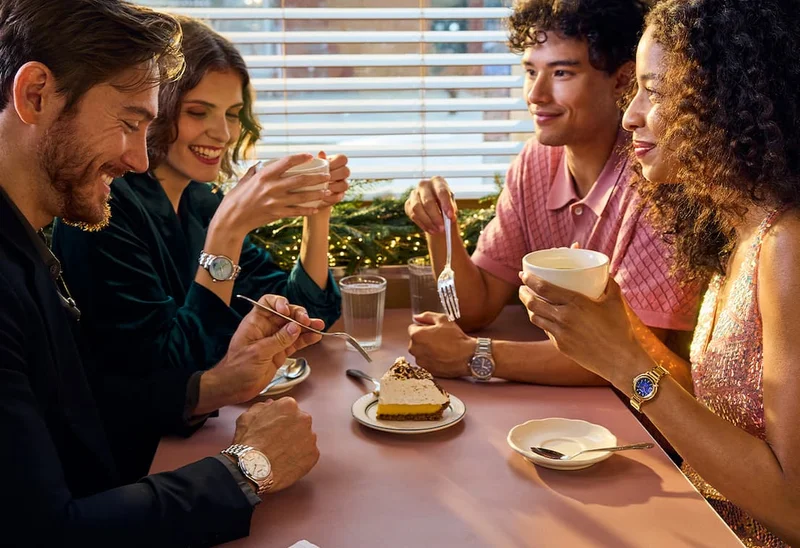 Group of people at a diner having drink and a pie