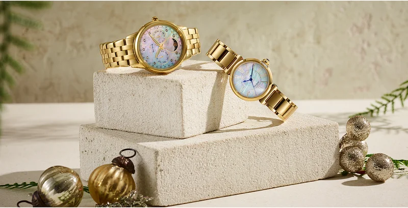 The festivities make their appearance at Citizen, with gift ideas for her. Will it be a classic Calendrier mother-of-pearl dial in gold-tone stainless steel—or the Citizen L Mae in gold-tone stainless steel, inspired by a vintage perfume bottle with a blue cabochon crown and mother-of-pearl dial.
