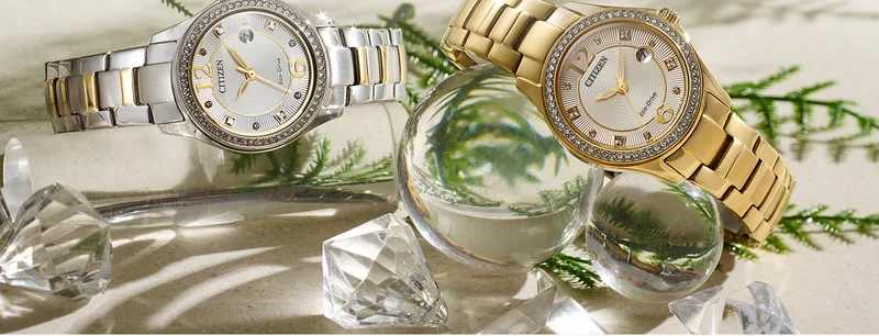 Two elegant Crystal watches in gold stainless-steel and a duo-tone silver/gold featured—perhaps for a special lady in your life.