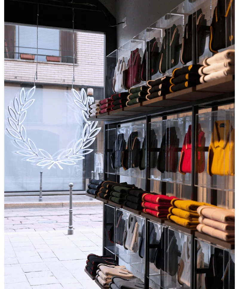 A photograph of the Fred Perry Polo shirt wall in the Milan store