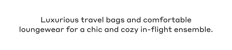 Luxurious travel bags and comfortable loungewear for chic and cozy in-flight ensemble.