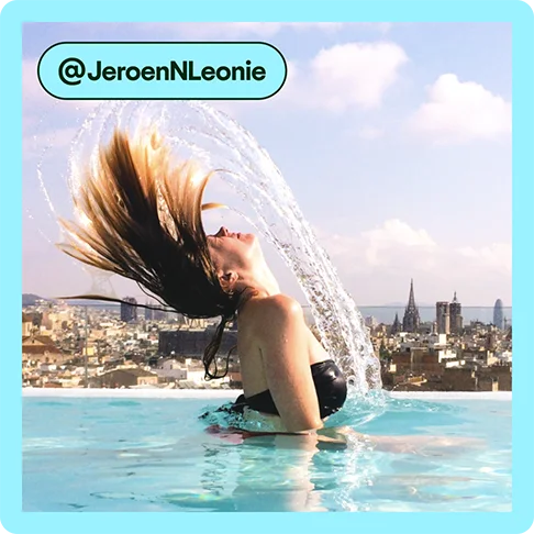 Image description: Woman in a rooftop pool flipping her hair, photo taken by @JeroenNLeonie