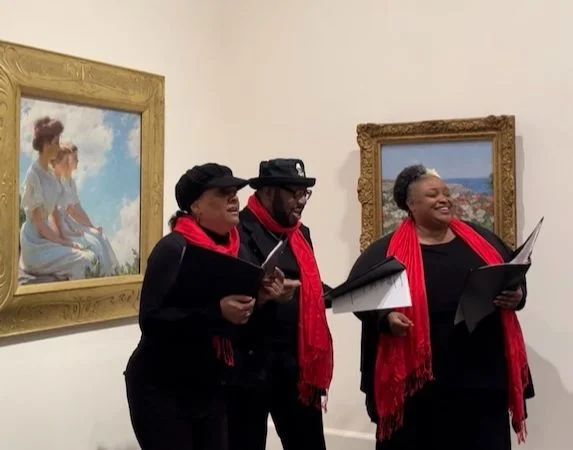 Carolers performing in the galleries