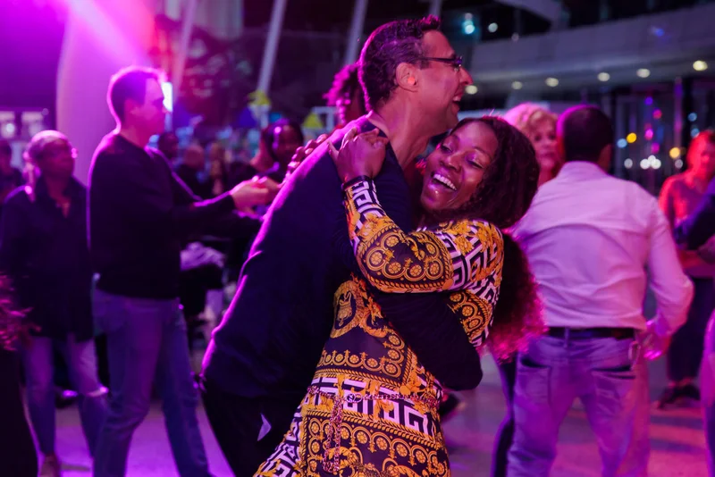 Two people salsa dancing