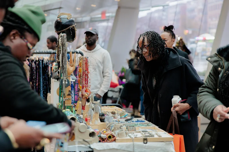 A person looking at merchandise in the Brooklyn Museum Shop