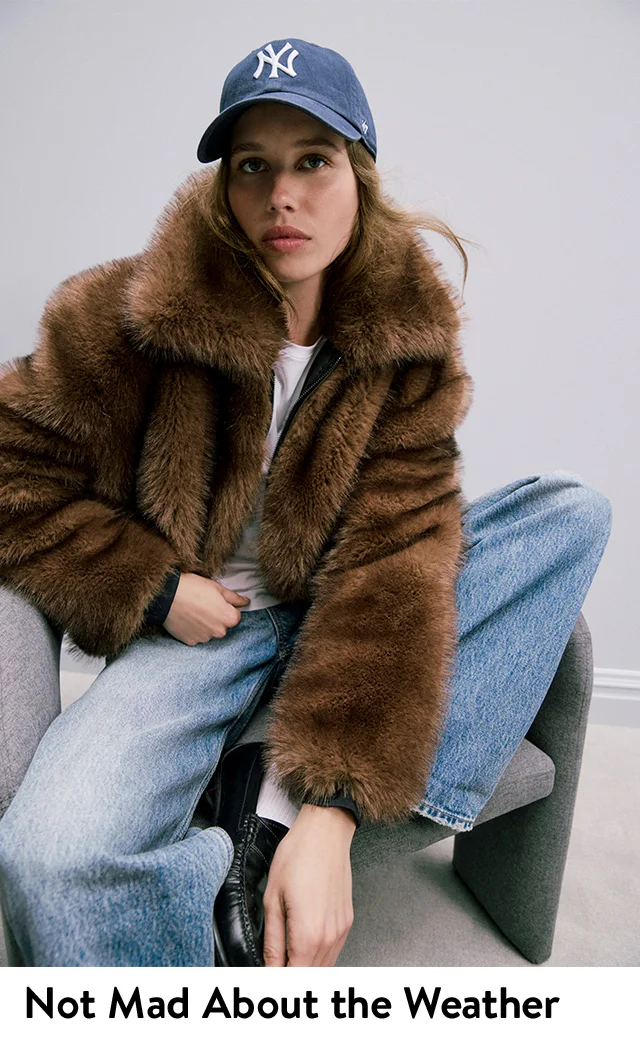 A woman wearing a faux-fur coat.