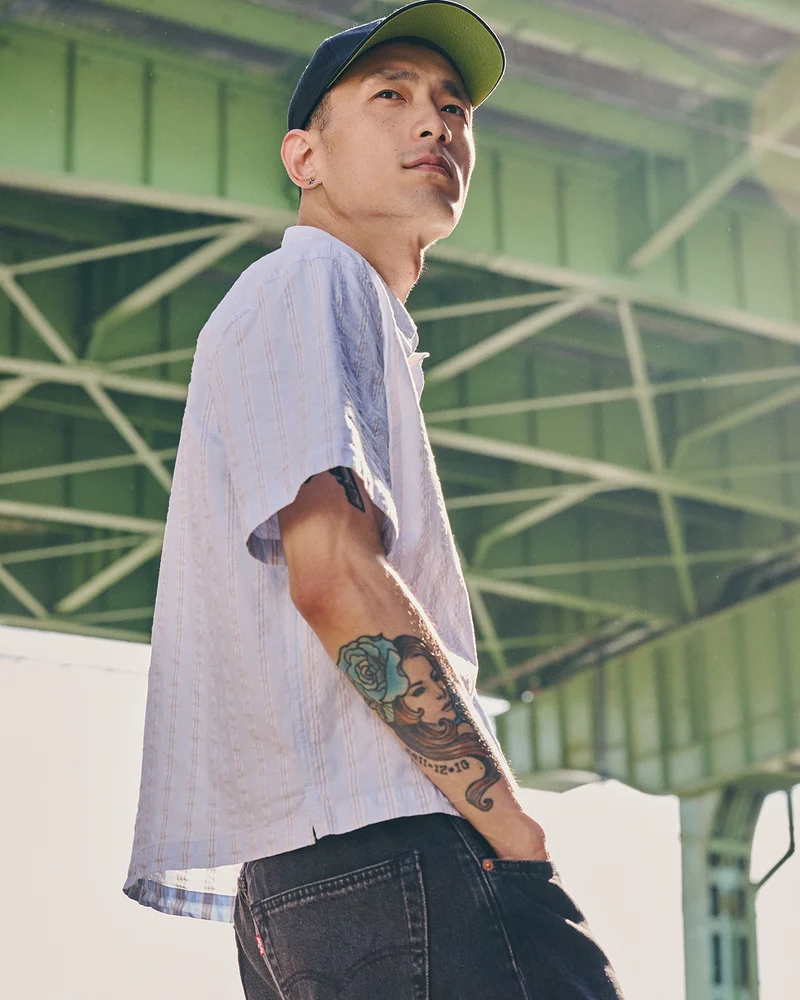 PERSON IN BUTTON DOWN