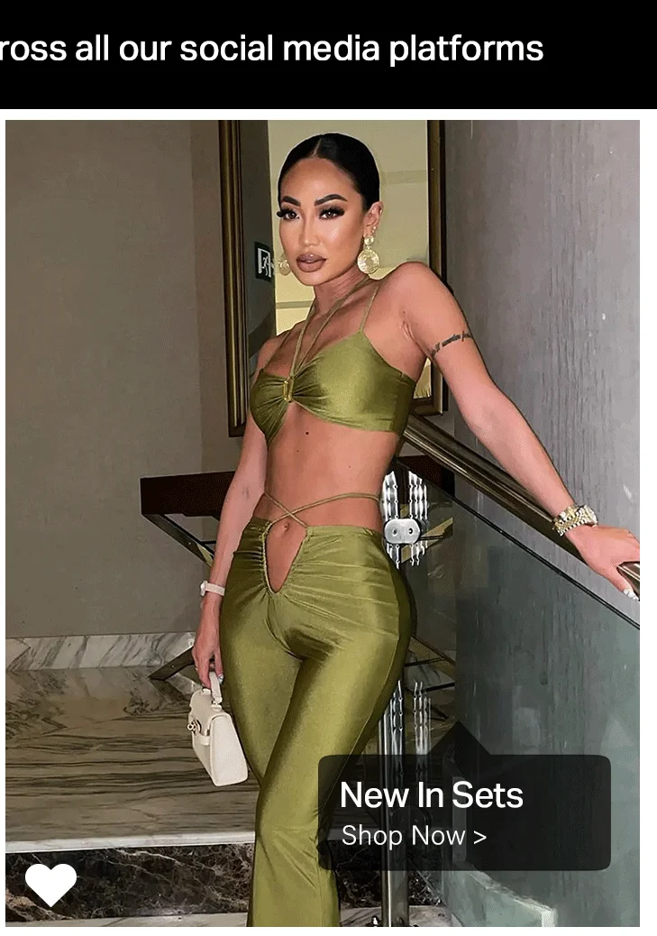 Stylish woman in a chic olive green matching crop top and cutout pants, with a white handbag. Showcasing new in fashion sets for online shopping.