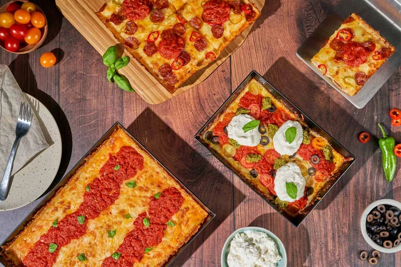 Detroit-style pizzas with a variety of toppings, cooked with Ooni.