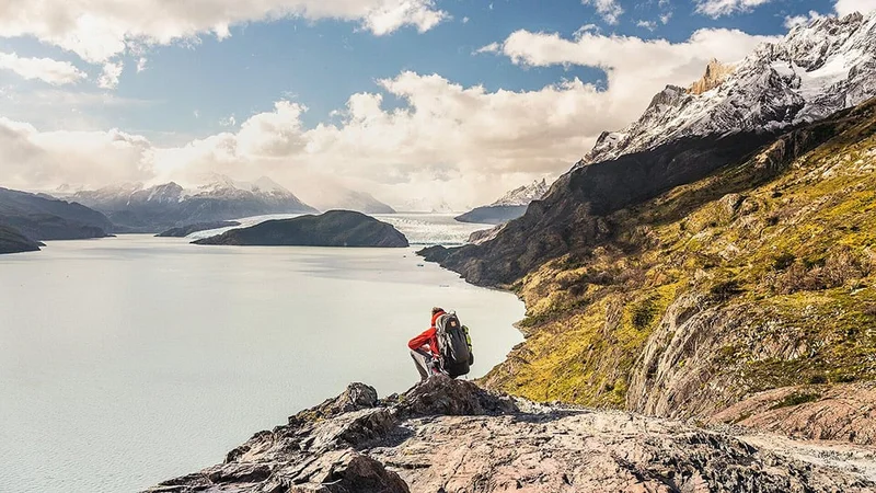 Image description: Tourist viewing glacier at Torres del Paine National Park, Chile.