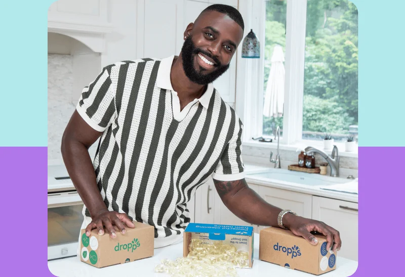 Image: Man showcasing Dropps products