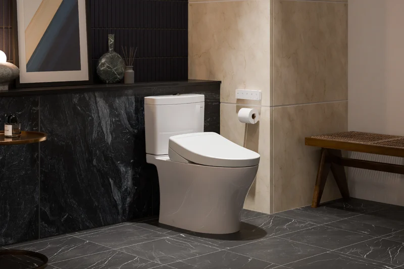 A WASHLET+ S5 bidet toilet is displayed in a modern masculine bathroom.