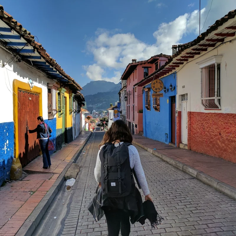 A woman walking through La Candelaria neighborhood in Bogotá, Colombia