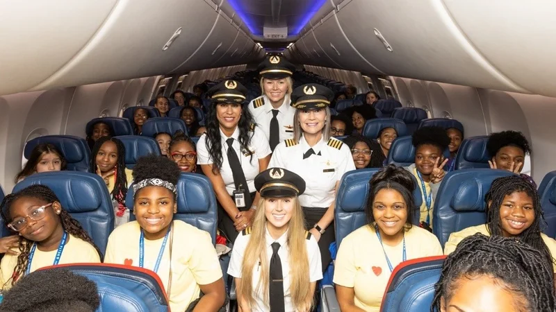 Delta pilots and attendees of Delta's WING Flight pose for a group photo