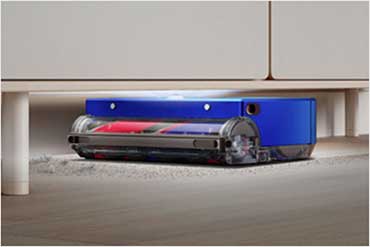 Dyson 360 Vis Nav™️ robot cleaning under furniture.