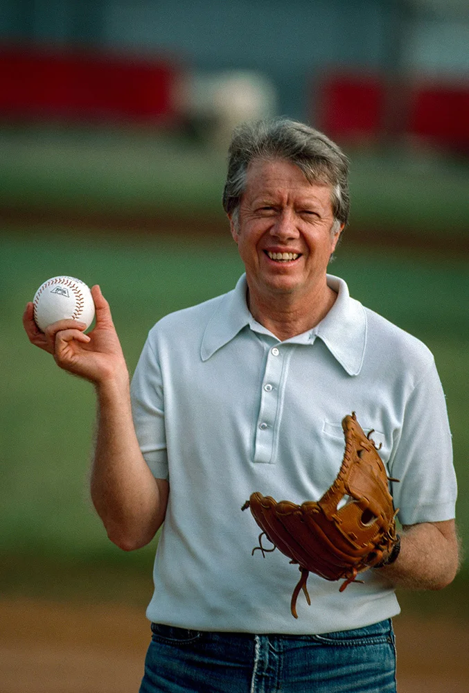 President Jimmy Carter holds a baseball