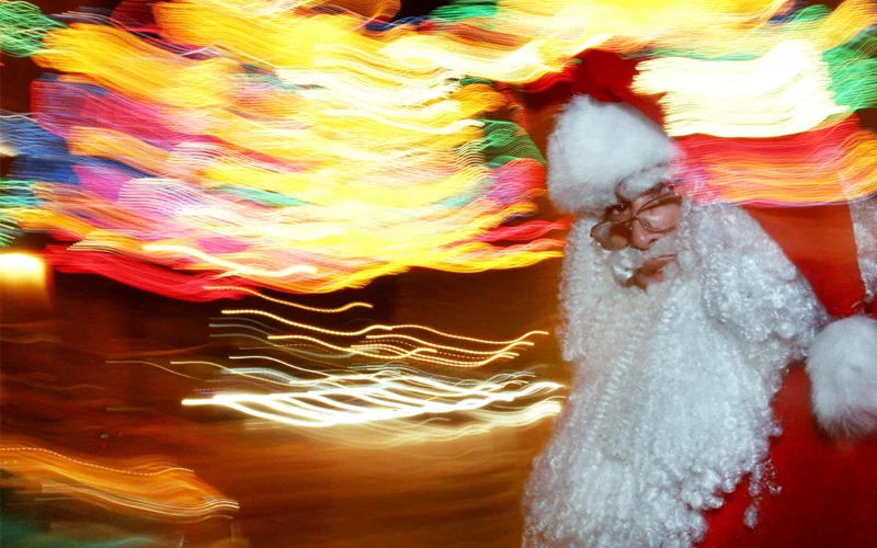 A man dressed as Santa Claus walks through Mexico City just a few days before Christmas. Popular theories suggest Santa was inspired by magic mushroom-eating shamans in northern Scandinavia.