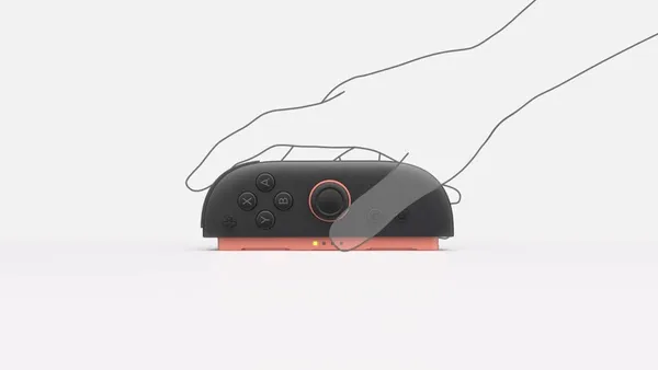 The right Joy-Con 2 controller is positioned on its side. An illustrated hand slides it forward and backward.