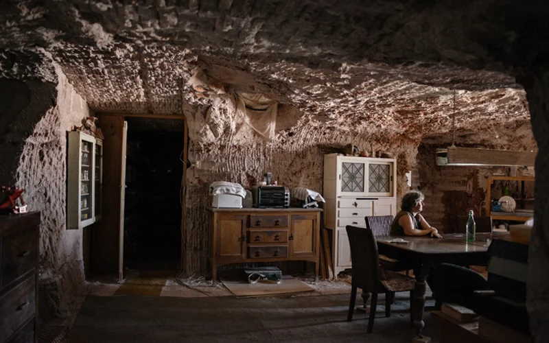 Gabriele Gouellain waits in the kitchen of her subterranean home for her husband to return from the opal mines around Coober Pedy, in South Australia.