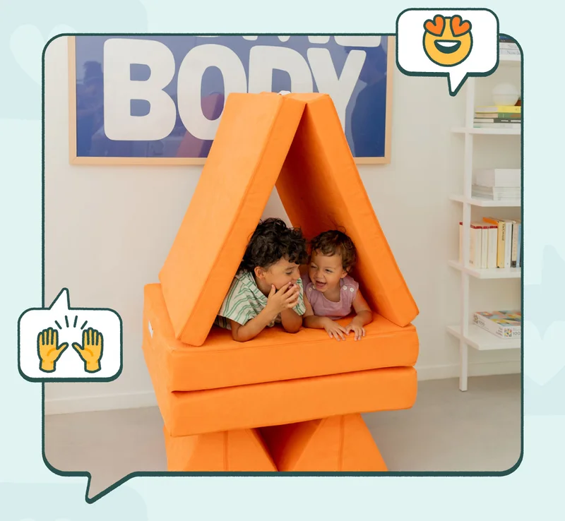 Two children share a secret inside a fort made out of a Nuggeteer Nugget.