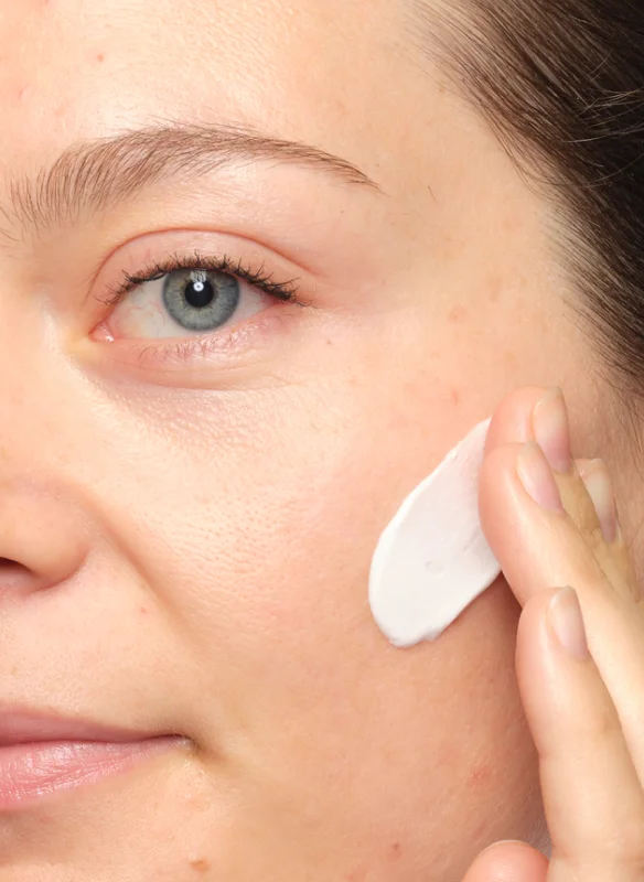 Caitlin applying Natural Moisturizing Factors + PhytoCeramides