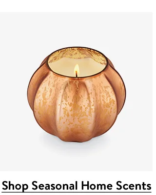 A pumpkin-shaped candle.