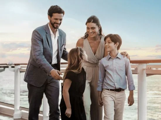 Click to View Holiday Cruises – Pictured: Family, Topside at Sunset