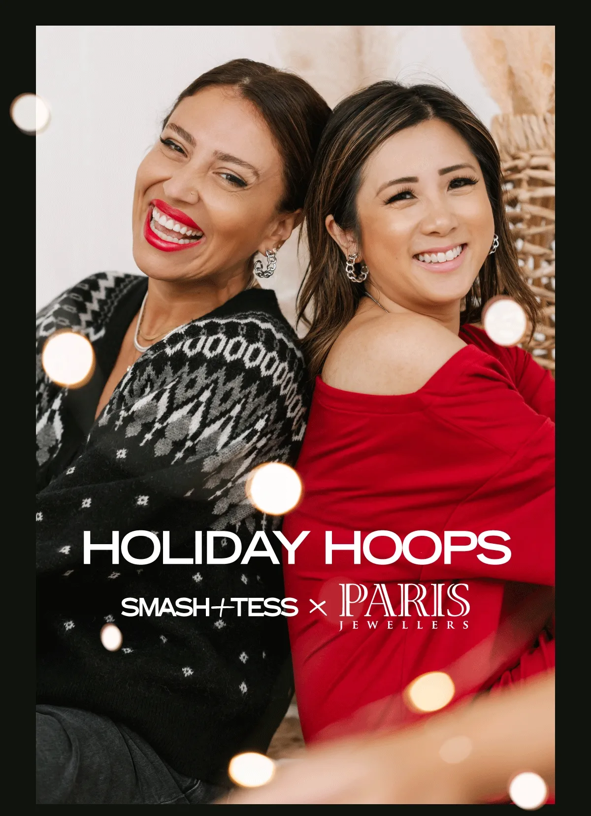 brunette women sat back to back wearing silver chain hoop earrings with caption 'holiday hoops'