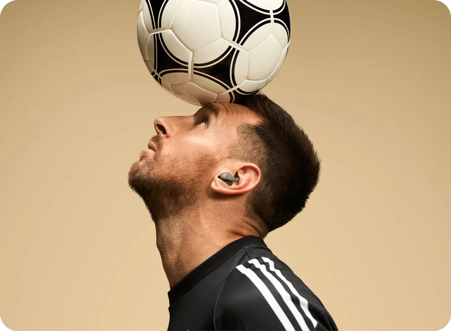 Messi wearing Beats Fit Pro in Sage Gray.