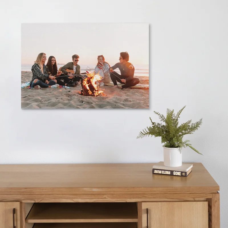 Canvas print of friends by the fire.