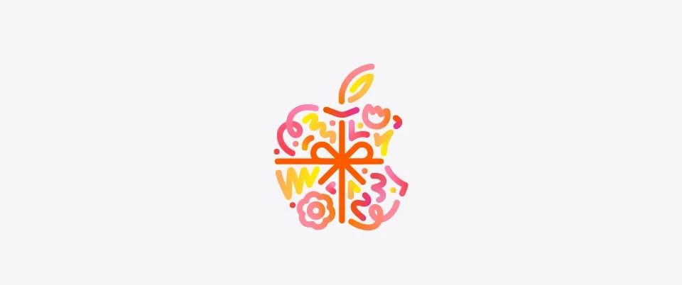 Dots, squiggles, spirals, and flower shapes in different hues of orange, pink, and yellow burst and spread across from behind Apple logo, wrapped in an orange color bow, made up of dots, squiggles, spirals, and flower shapes in different hues of orange, pink, and yellow