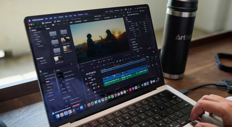 Image of someone editing their film on a laptop