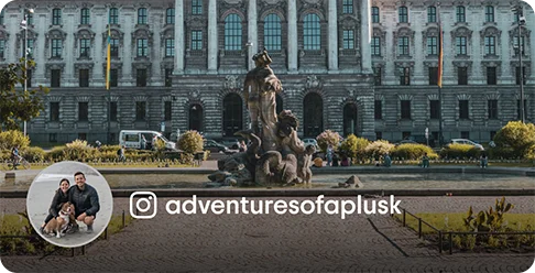 Image Description: An elaborate building with a statue in the garden. A profile photo of two people with a dog and a camera icon with the handle adventuresofaplusk are on the image.