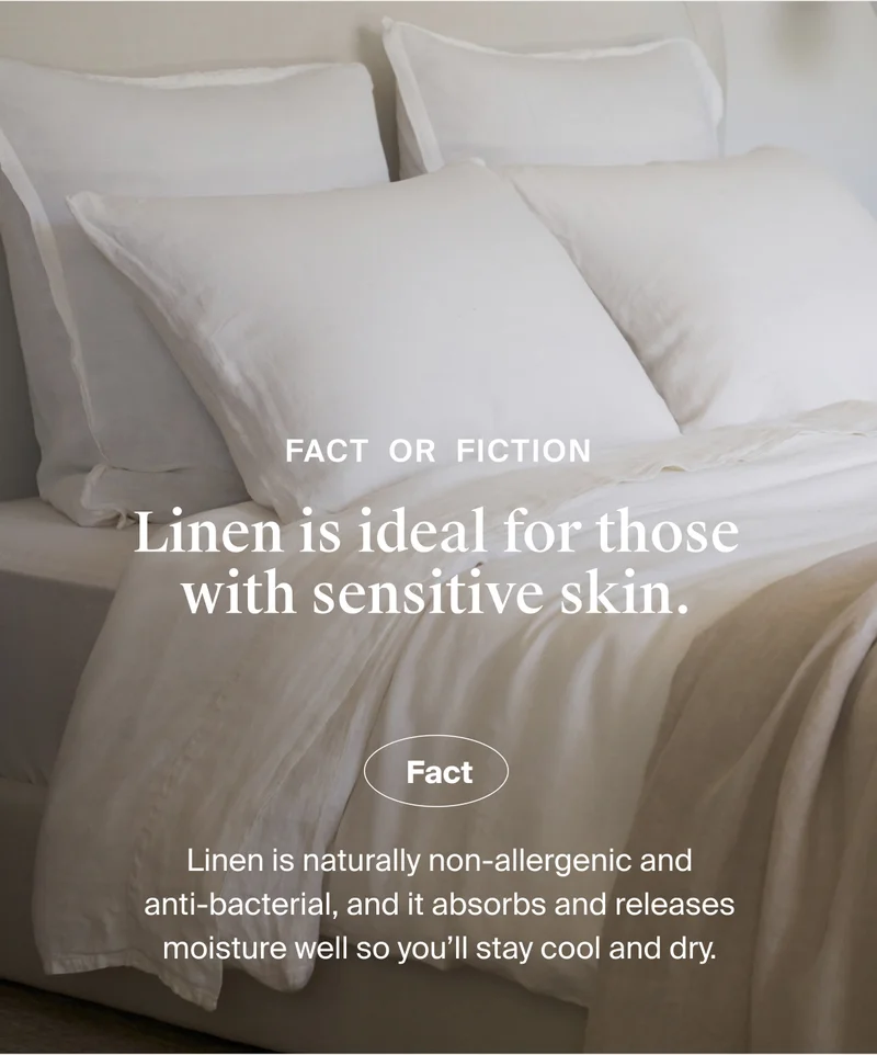 Bed made with white linen bedding.