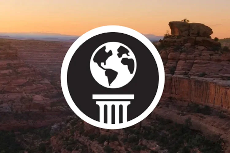 Graphic of the earth on top of a marble column.