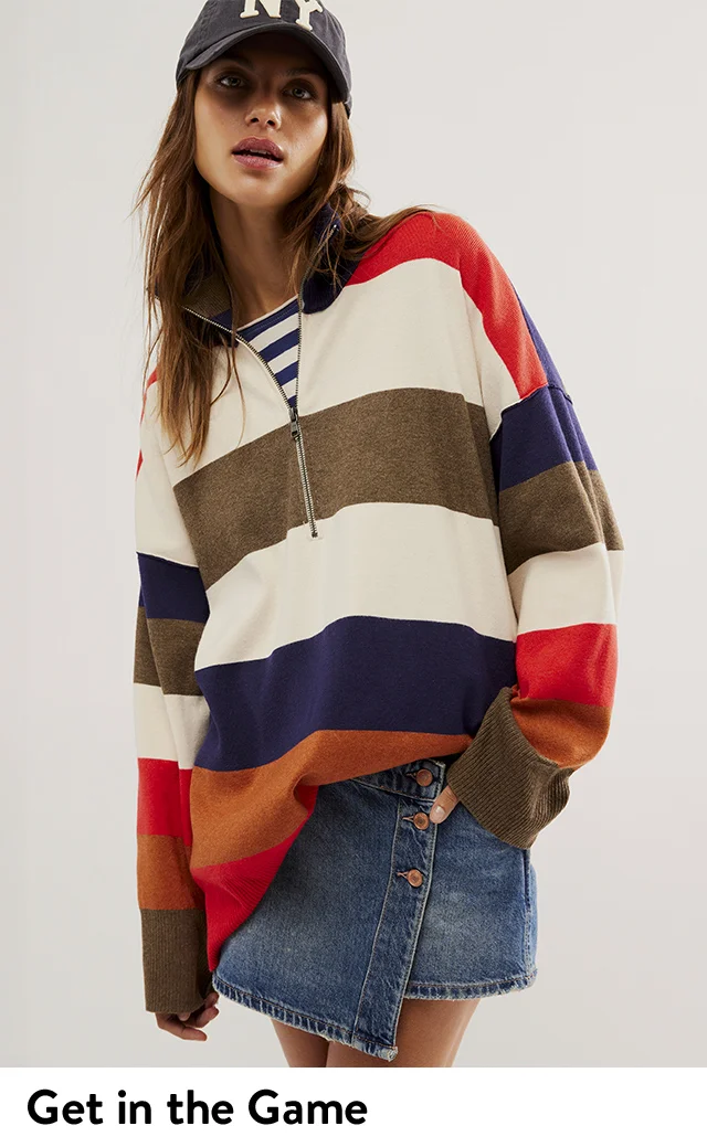A woman wearing a baseball cap and striped quarter-zip top. A woman wearing a striped quarter-zip top over a collared shirt.