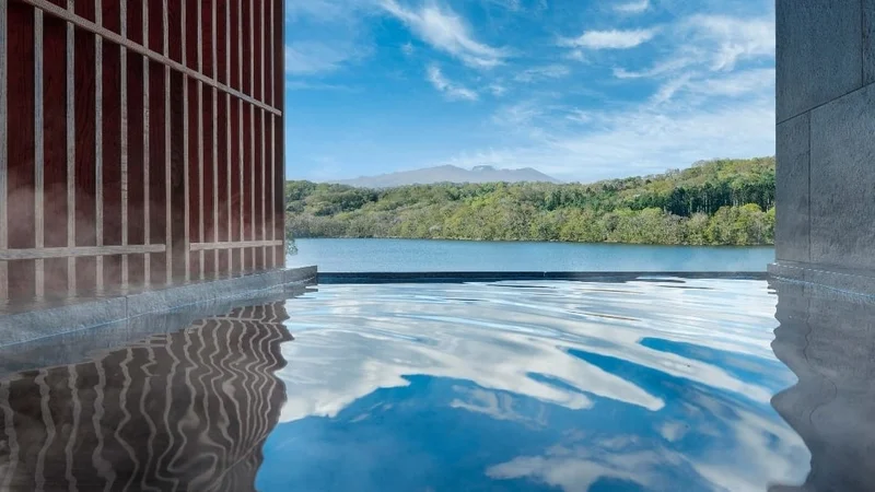 Image description: Japanese onsen with view of a garden at KAI Poroto, Tokyo