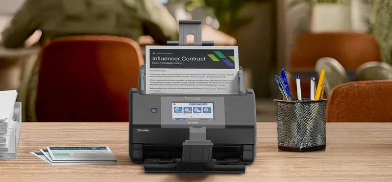 Image: the WorkForce ES-590 on a table in a cafe style environment