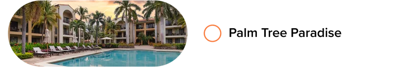 Resort-style pool courtyard with palm trees, loungers, and low-rise buildings at sunset.