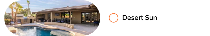 Desert-style home with curved pool, covered patio, outdoor grill, and lounge seating.