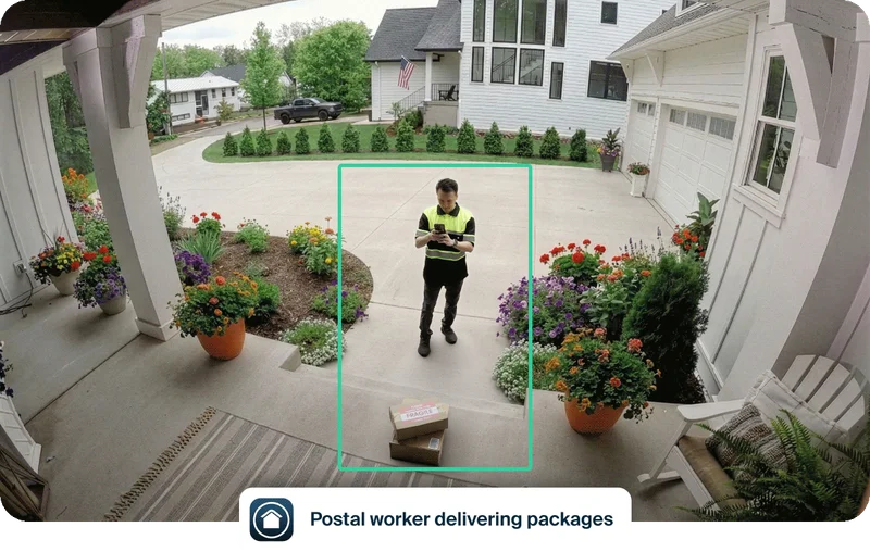 Simulated point of view image depicting a postal worker delivering packages to the front porch of a home. Simulated user interface elements overlay the image depicting an example of event captions that say: Postal worker delivering packages.