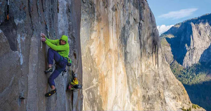 A climber works an extremely difficult pitch on a big wall.