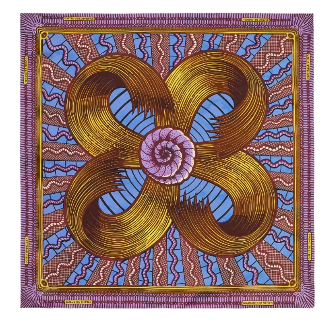 A patterned scarf of purple, gold, and blue