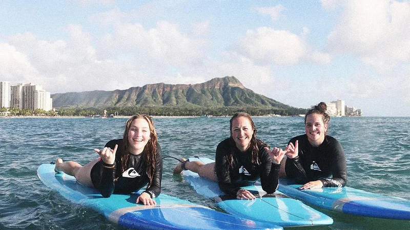 Image description: Friends on a Waikiki Private Group Surf Lesson.