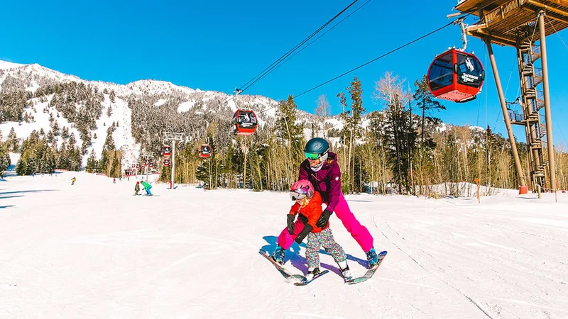 Image description: Family learning to ski together at the Jackson Hole Mountain Resort.